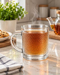 Clear textured glass tea cup with hot tea