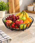 Black wire fruit basket with fruit
