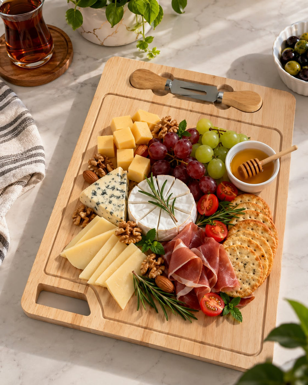 Wooden cheese board with cheese and appetizers