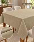 Beige textured tablecloth 140 x 180 cm on dining table