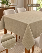 Beige textured tablecloth 140 x 180 cm on dining table