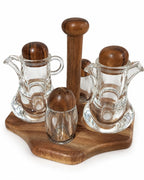 Dark wood glass oil vinegar and spice condiment set on white background