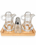 Glass oil vinegar and spice condiment set on bamboo tray
