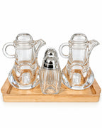 Glass oil vinegar and spice condiment set on bamboo tray