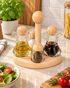 Glass oil vinegar and spice condiment set with wooden stand in kitchen