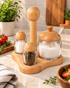 Glass spice and sugar condiment set with wooden lids and stand in kitchen