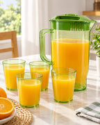 Transparent green pitcher and cup set with orange juice