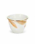 White and gold leaf coffee cup close-up