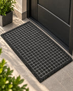 Square grid textured doormat in black and brown
