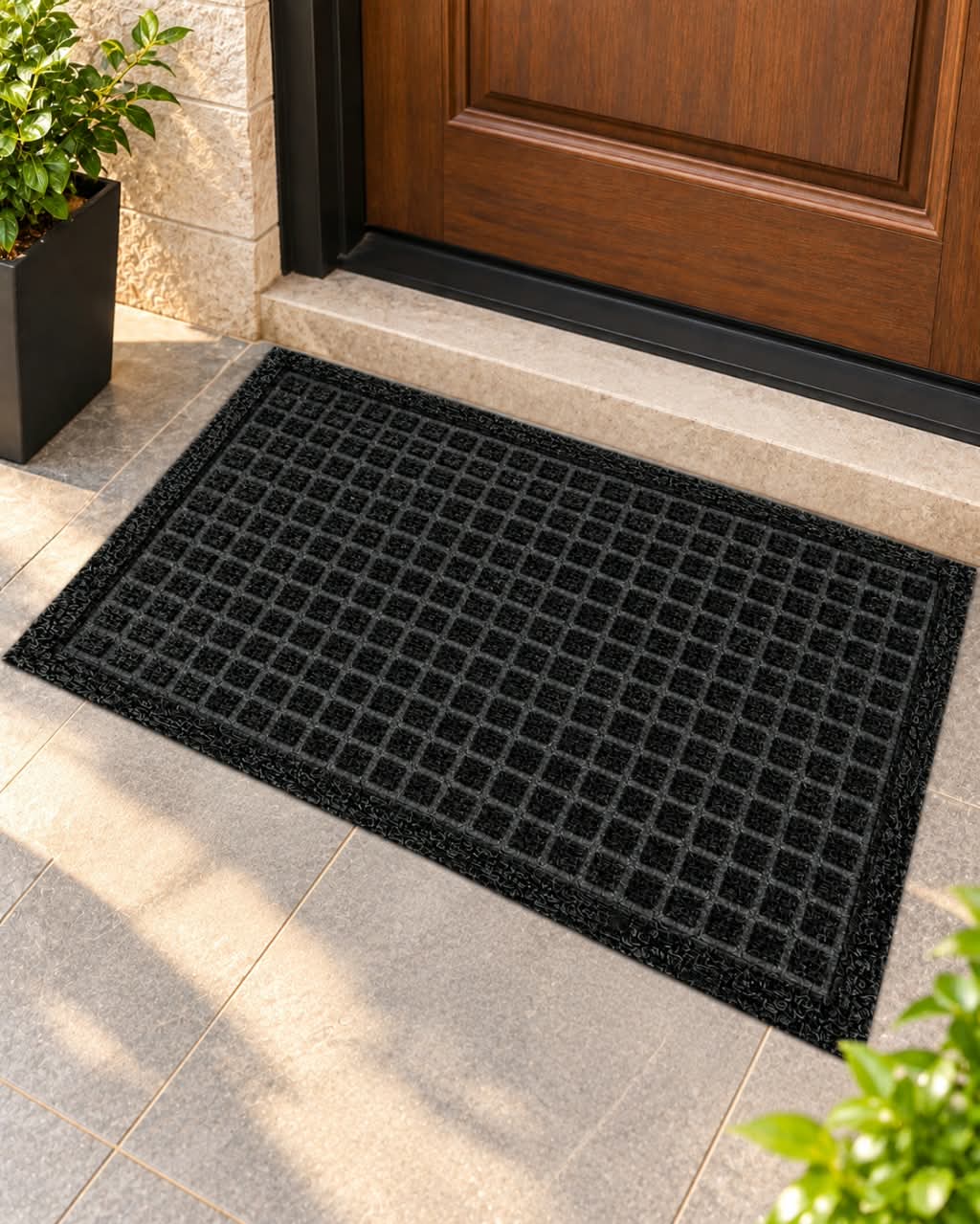 Square grid textured doormat in black and brown