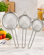 Three stainless steel mesh strainers