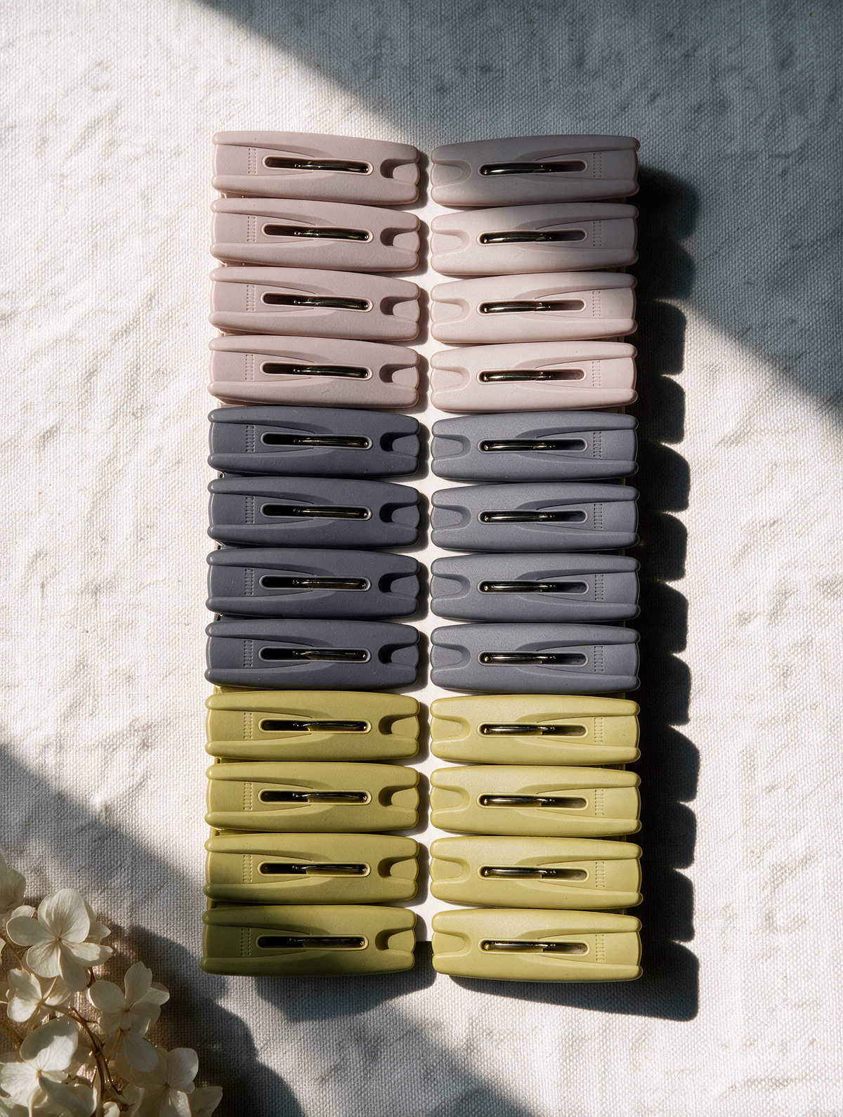 24-piece classic laundry clothes peg set arranged in a lifestyle scene