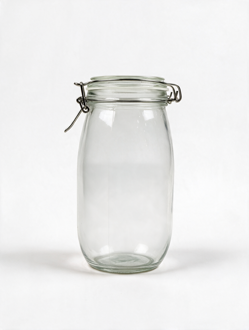 Clear clip-top glass storage jar on a white background