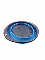 Top view of collapsible silicone colander in blue on white background
