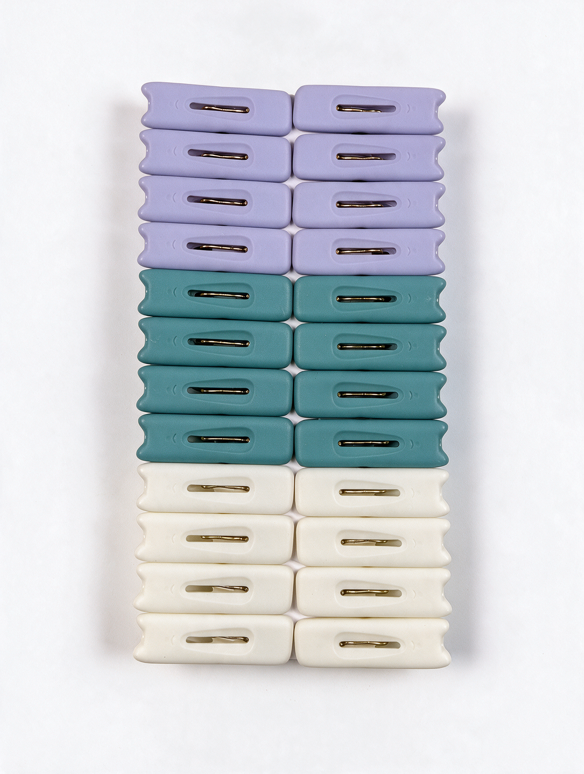 Assorted laundry clothes pegs set on white background