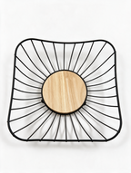 Top view of black metal fruit basket with wooden center