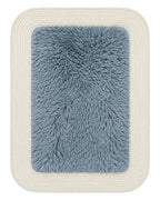 Rectangular furry rug in blue on white background