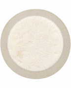 Round furry area rug in ivory on white background