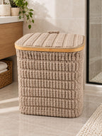 Square textured laundry basket with lid styled in a bathroom
