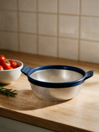 Stainless steel colander on a kitchen counter