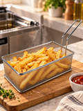 Stainless steel deep fryer basket filled with golden fries